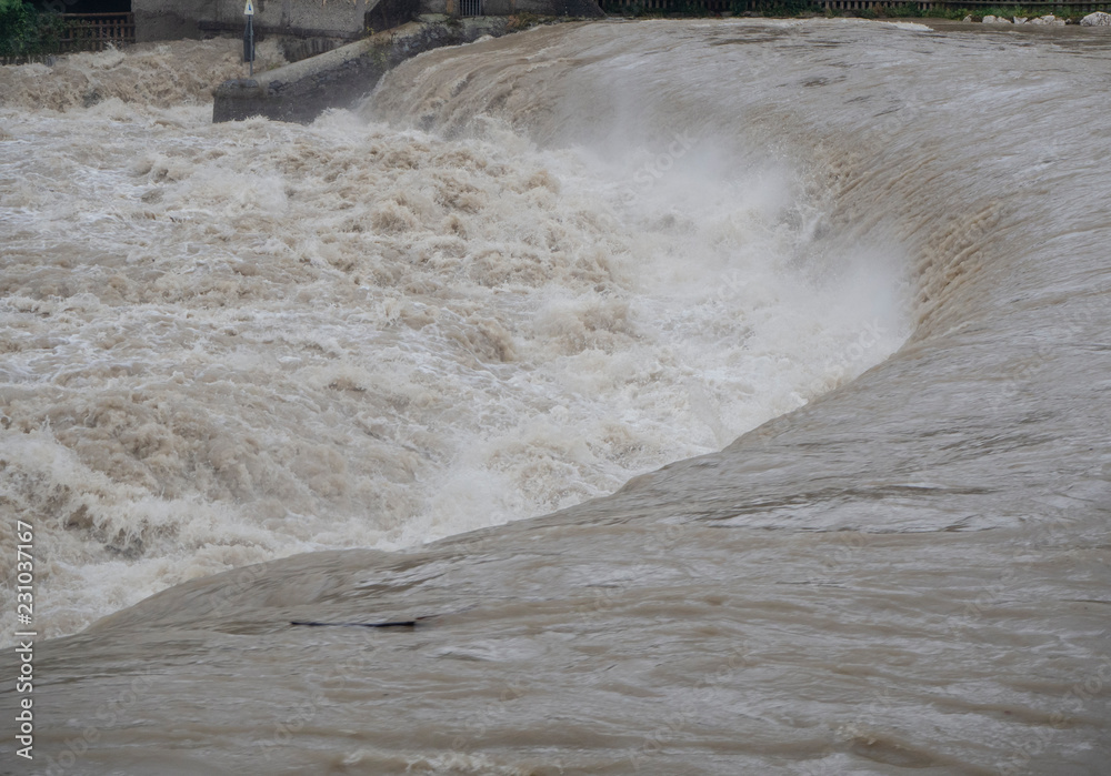 Wall mural the serio river swollen after heavy rains. province of bergamo, northern italy