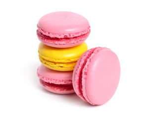 A macaron or French macaroon. Small present with yellow and pink. Isolated