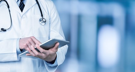 Close-up Doctor at hospital working with tablet pc