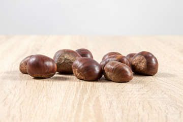 chestnuts on wooden background