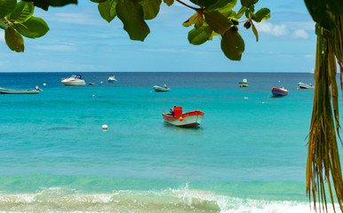 tropical beach with  fisher boats