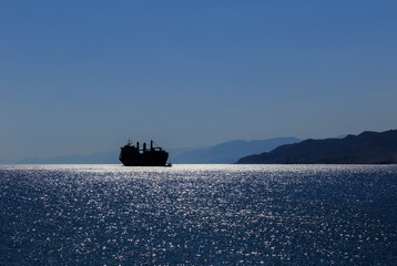 Silhouette of a ship in the Gulf of Aqaba of the Red Sea