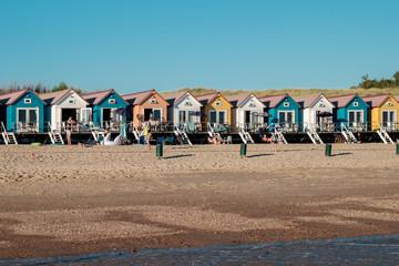 Row of colorful beach houses in Zeeland, Netherlands