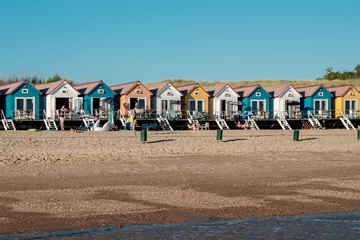 Foto op Plexiglas Row of colorful beach houses in Zeeland, Netherlands © Erik_AJV