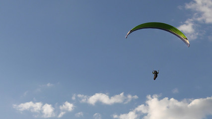 Flying paragliders.