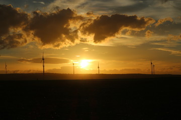 Sunset over the field of wind turbines, Austria
