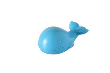 Image of plastic baby toy blue whale isolated on white background.