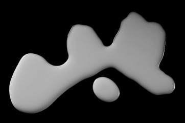 Spilled milk puddle isolated on black background and texture with clipping path, top view