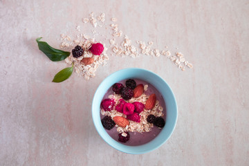 Breakfast with granola , almond, raspberry and blackberry 