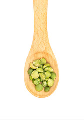 Dry green peas in spoon