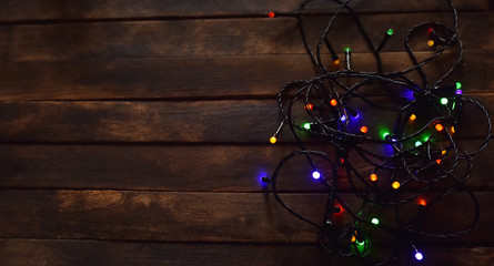 colorful lights in garlands on a dark background
