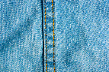 Blue washed faded jeans texture with seams