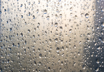 background of raindrops on window glass, close up