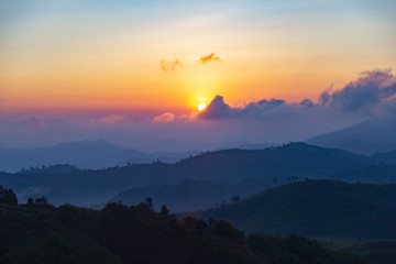 Landscape of the mountain with blue sky in the morning. Beautiful mountain with cloud and sunrise at Tong Pha Phoom national park ,Thailand.