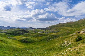 Fototapeta na wymiar Panoramic view in Durmitor, Montenegro. Mountain road.