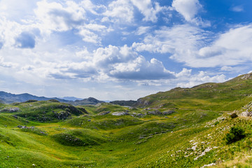 Fototapeta na wymiar Panoramic view in Durmitor, Montenegro. Mountain road.