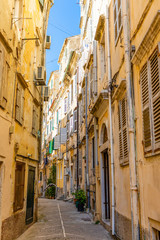 Fototapeta na wymiar View of typical narrow street of an old town of Corfu in Greece