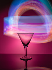 Martini glass on the background of neon lights
