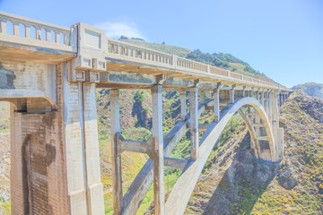 Iconic Bixby Bridge on Pacific Coast Highway Number 1 in California, United States.Bixby Bridge is located near Pfeiffer Canyon Bridge collapsed in Big Sur. American travel concept. Soft light.