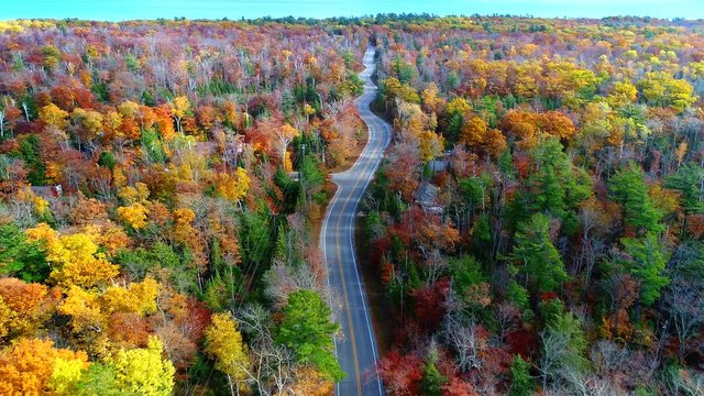 Aerial view of winding country road through breathtaking Autumn colors. This is Highway 42 in Door County, Wisconsin.