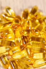 Close up view on golden medical pills 