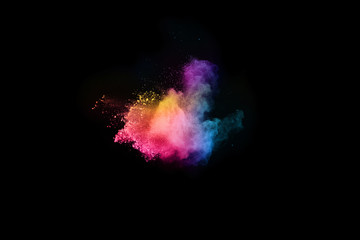 abstract colored dust explosion on a black background.abstract powder splatted background. © kitsana