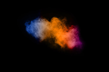 abstract colored dust explosion on a black background.abstract powder splatted background.