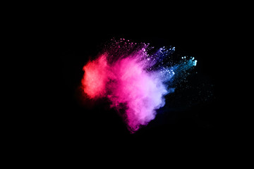 abstract colored dust explosion on a black background.abstract powder splatted background.