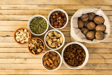 Obraz na płótnie Canvas Top view of variety of nuts and seeds