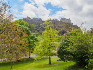 Edinburgh Castle seen from the Princes Street Gardens on a bright sunny day.