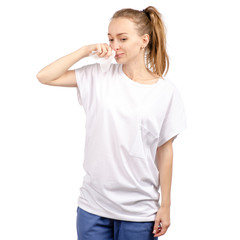 Beautiful woman is sick colds wipes nose on a white background. Isolation