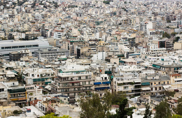 Fototapeta premium over crowded and human pollution concept of south big city apartment buildings with aerial foreshortening from above 