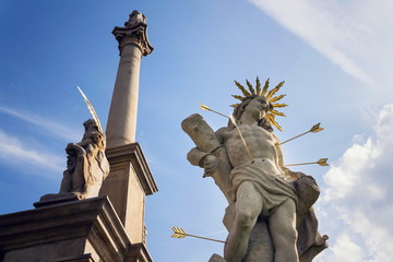 Saint Sebastian shot with arrows martyr statue, Marian plague column of Saint Rosalia, Velehrad Monastery, Moravia, Czech Republic, sunny day clear blue sky