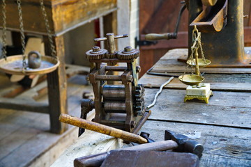 old tools and mechanisms on a wooden table