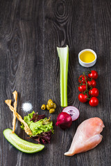 ingredients for cooking, chicken breast and vegetables on a wooden table - 231070142