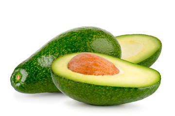 Avocado and two halves close-up on a white. Isolated.