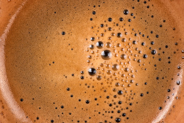 Coffee foam into cup texture and background