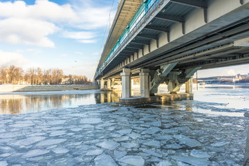 View of the bridge and the freezing river
