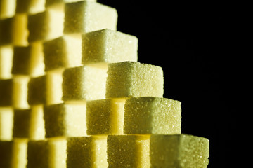 A composition of sugar cubes illuminated with multicolored light sources
