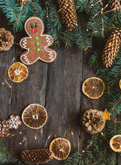 Gingerbread men laying on wood background. Christmas or New Year composition.