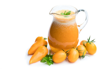 Fresh tomato juice made from the golden-yellow tomatoes in jar isolated