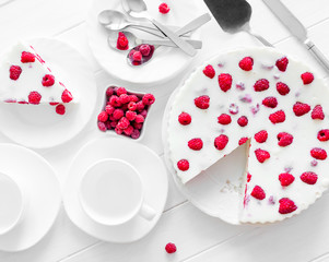 Panna cotta raspberries on a wooden table