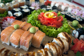 sushi on a plate decorated with sakura flowers