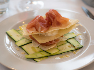 starter, ham with crunchy bread, mozzarella and zucchini