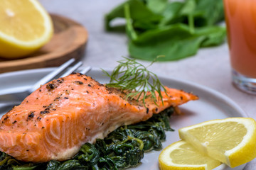 Baked salmo trutta on spinach - healthy food