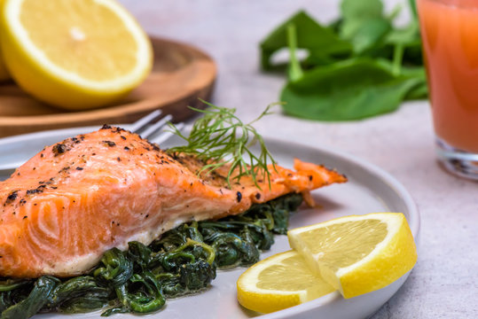 Baked salmo trutta on spinach - healthy food