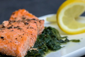 Baked salmo trutta on spinach - healthy food