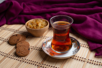 Homemade oatmeal cookies with a cup of tea on old wooden background, A cup of tea with raisin, a cup of tea with chocolate