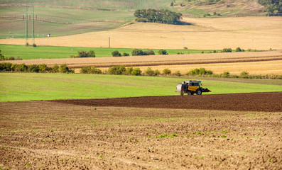 Fototapeta premium Tractor plowing the field