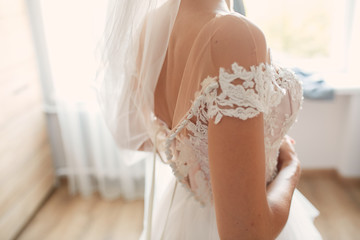 Close-up of tender bride's naked shoulders
